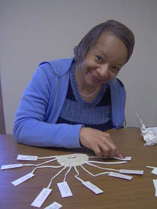 Lady learning to read with Davis® dyslexia program