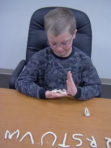 boy with clay Dyslexia Davis® program