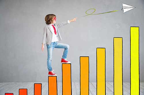 Boy climbing to success
